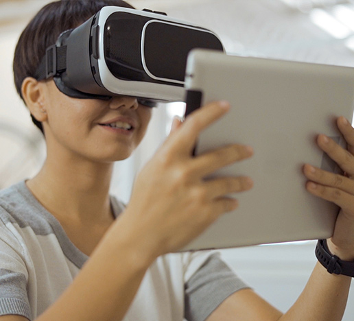 Kid-using-tablet-with-virtual-reality-glasses