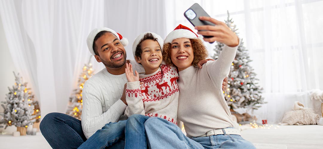 Family taking selfie at holiday time