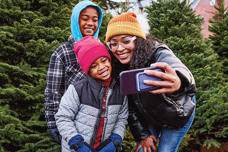 Mother and children taking selfie